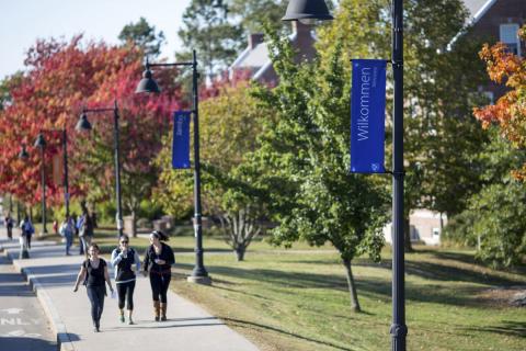 students on unh campus main st banners