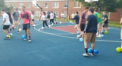 residents of gibbs playing on sports courts