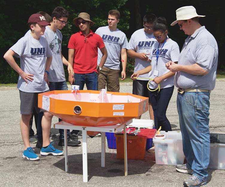 UNH Project SMART participants with scientific balloon payload/re-entry vehicle