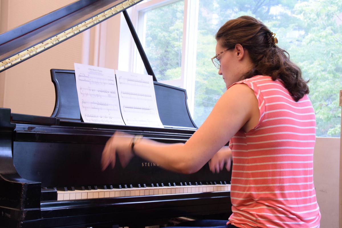 Pianist in UNH Wind Symphony rehearsal