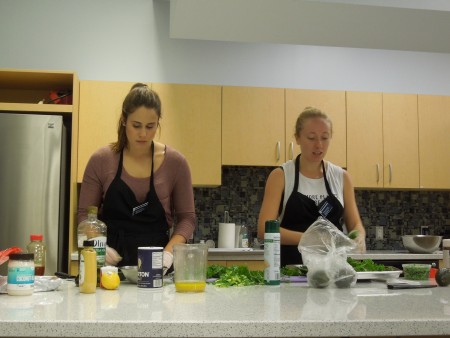 UNH Nourish peer educators Rachel Artus ’18 and Brooke Kealey ’18 lead a What's Cooking? class.