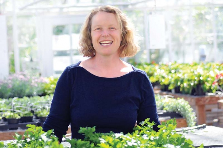 Researcher Becky Sideman in a greenhouse