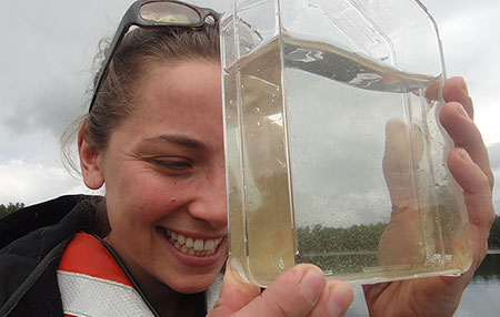PDoctoral student Amanda Murby '06, '09G, '14G inspects the catch.
