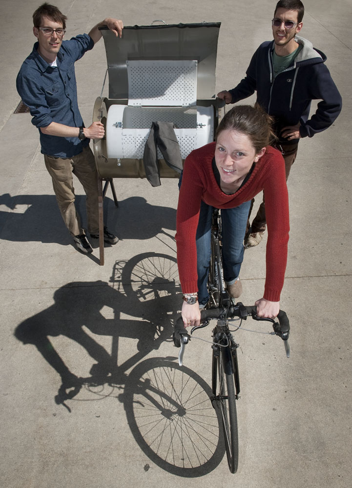 For their senior project, Vincent Lyon, (from left), Britta Moore, and Garrett Cassidy fabricated a bicycled-powered washing machine that can clean a load of clothes in 30 minutes using only six gallons of water.
