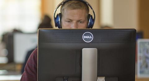 student sitting at computer