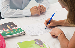 Student having his resume reviewed at UNH in partnership with Career and Professional Success