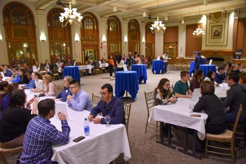 Image of UNH students and alumni practicing networking skills at No Stress Networking Night