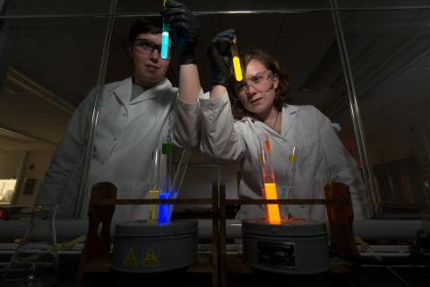 UNH students evaluating chemicals in a lab