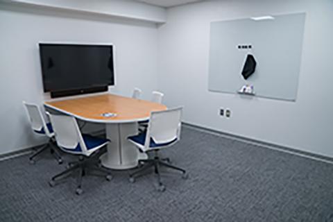 Features: 5 chairs, table, video conference technology with HDMI and USB cables, 3 whiteboards with dry erase markers.