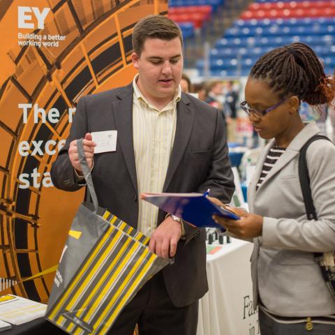 UNH Student with employer at UNH Career Fair