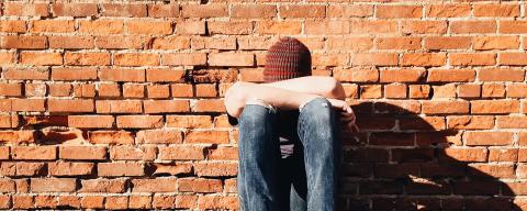 young person with head down