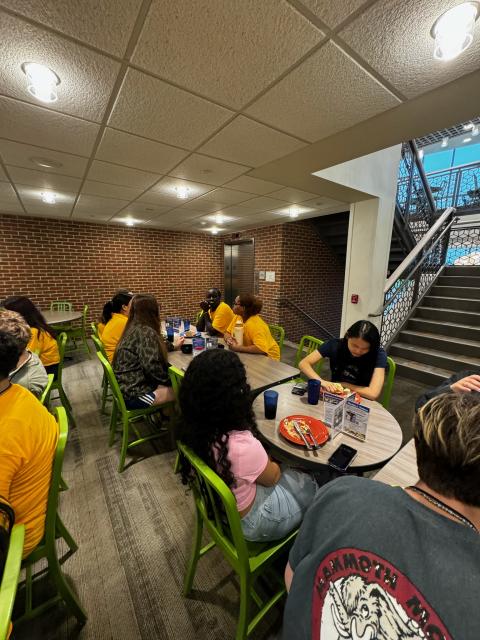 Students at a cafeteria eating lunch. 