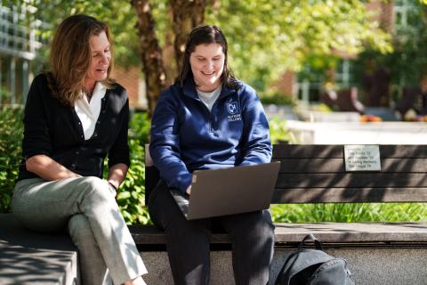 faculty and student talking