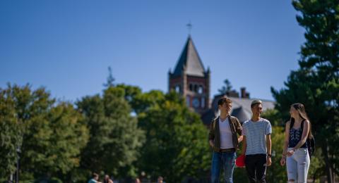 A group of students walking on campus during daytime