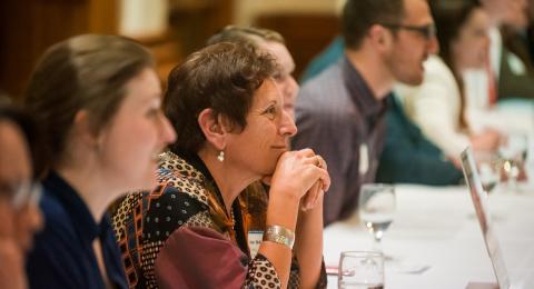 People seated at a table in a networking workshop