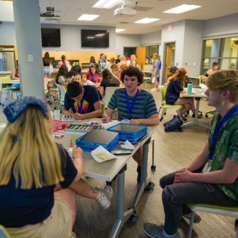 Students speaking around a table