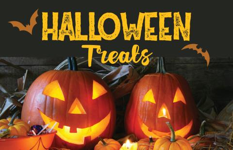 Halloween treats text with bats and pumpkins