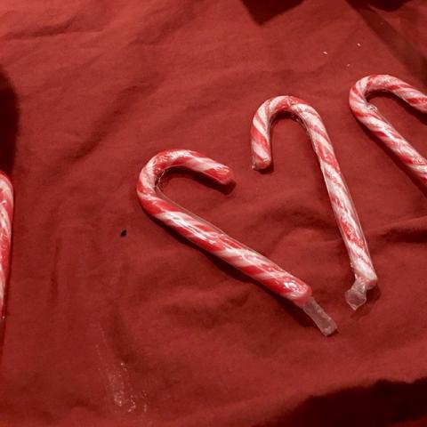 Two candy canes in the shape of a heart