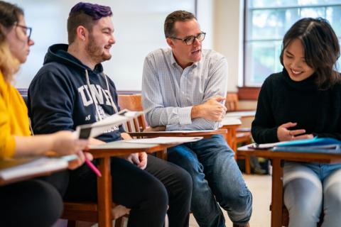 students and professor in Murkland Hall