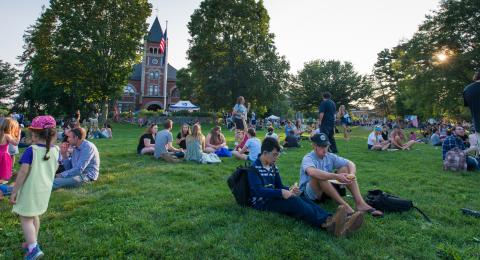 people sitting on t-hall lawn