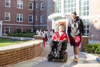 student in wheelchair on Congreve ramp