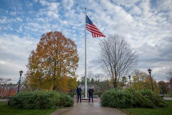American flag and ROTC students