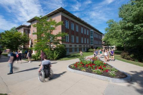 Rolling wheelchair across campus