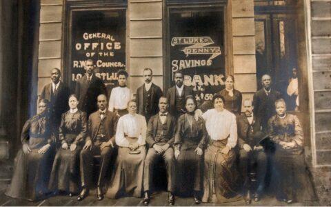 Group photo black people outside of bank 