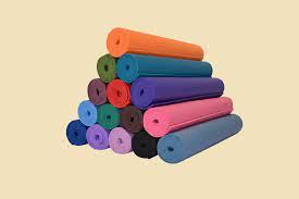 multiple colored yoga mats stacked in pyramid shape