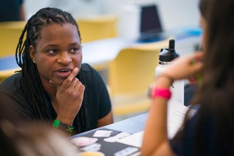 Professor talks to student at UNH