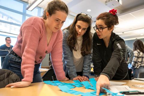 Students and teachers collaborate with sticky notes