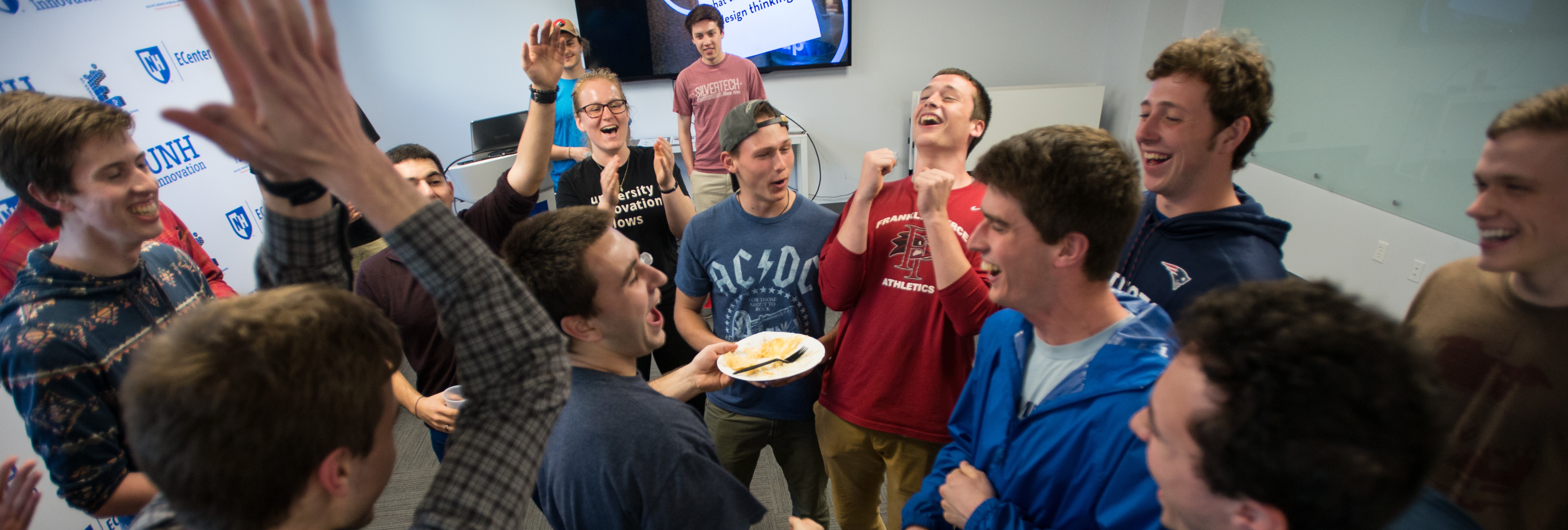 UNH EClub students celebrate with pizza
