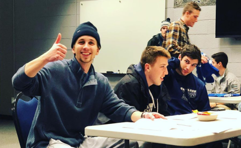 students sitting at table
