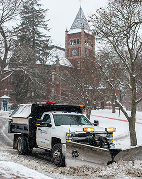 snow plow in front of t-hall
