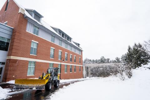 construction vehicle on campus during the winter