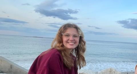 Woman on the beach doing research