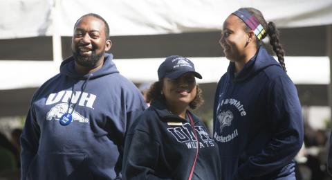 a family in UNH gear