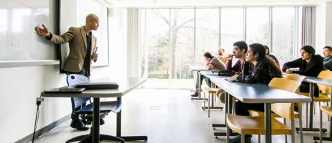 A professor teaching a classroom