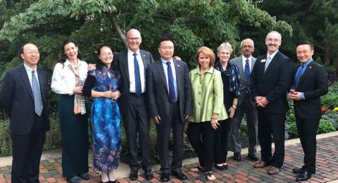 UNH President Dean and Chengdu University President Wang (3rd and 4th from left) with other university staff