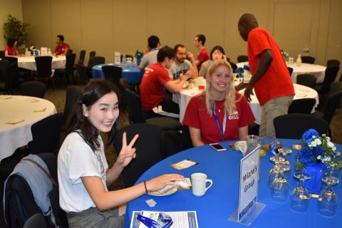 international students sitting at a round table