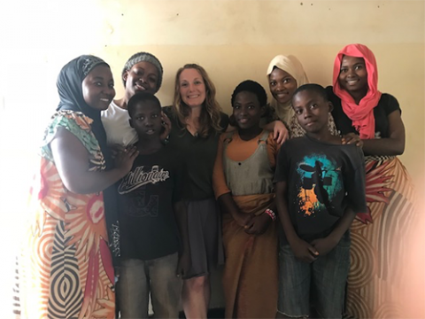 Dr. Amy VanCamp (center) during a home visit with a refugee family