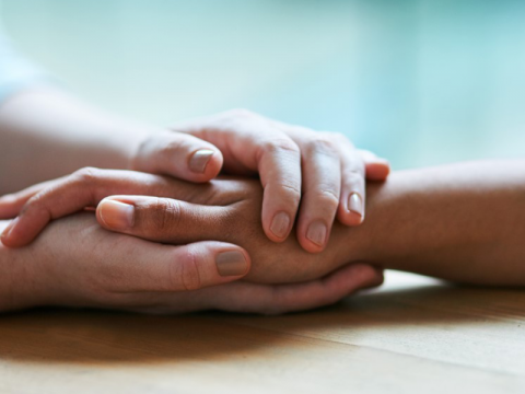 emotional wellness holding hands