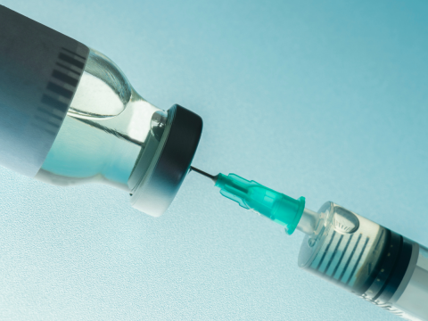 Vaccine serum and needle 