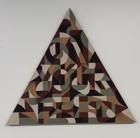 A triangle shaped painting filled with browns and greens