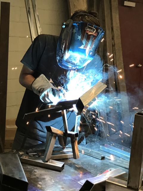 person in welding gear