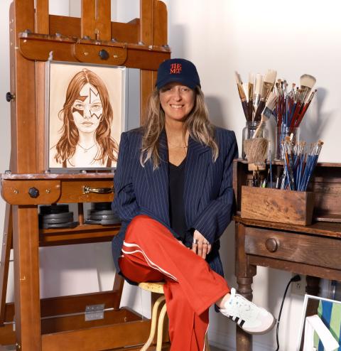 Woman next to painting 