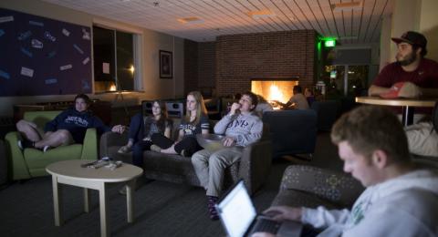 students watching a movie in Jessie Doe lounge