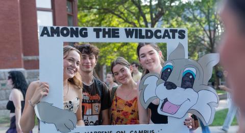 U-Day Sign for Tabling - Students Smiling