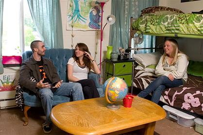students sitting and chatting in dorm room