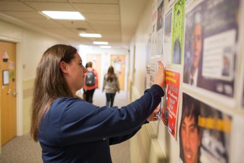 RA putting a poster